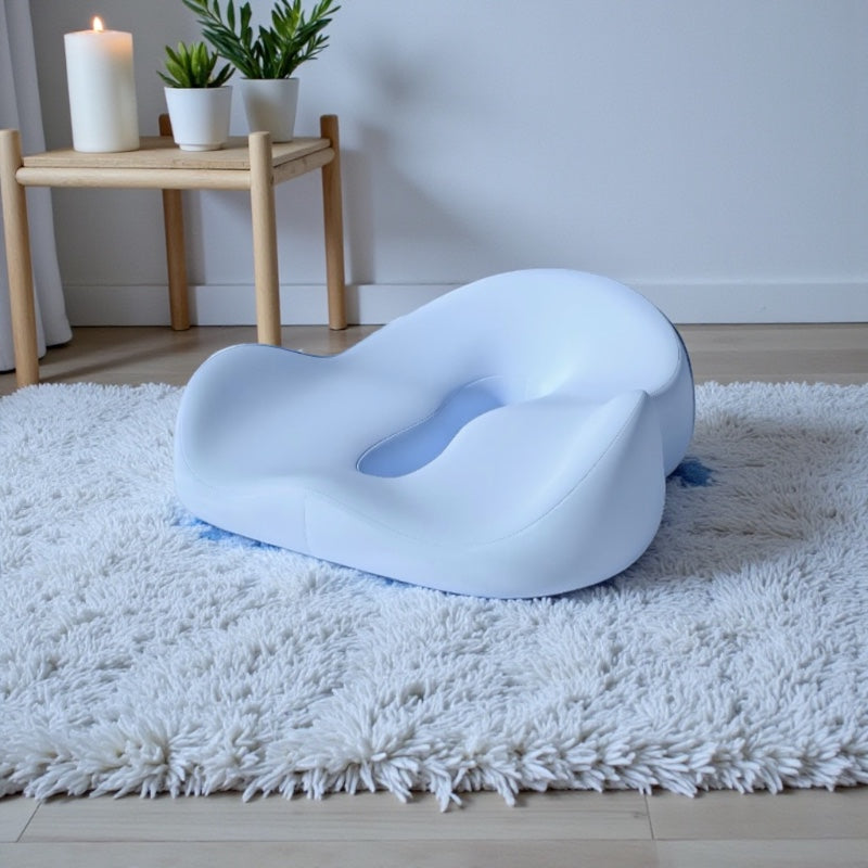 NuVibe™ Comfort Core Seat Cushion in Lavender Blue in a calm wellness room, ergonomic seat cushion designed for posture support and relaxed everyday sitting.