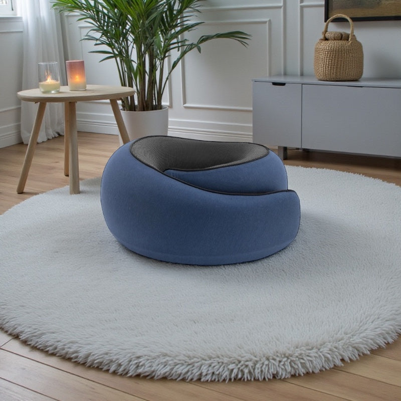 NuVibe™ ErgoNick Pillow in Midnight Blue in a calm wellness room, ergonomic neck pillow designed for all-round neck comfort and relaxed seating.