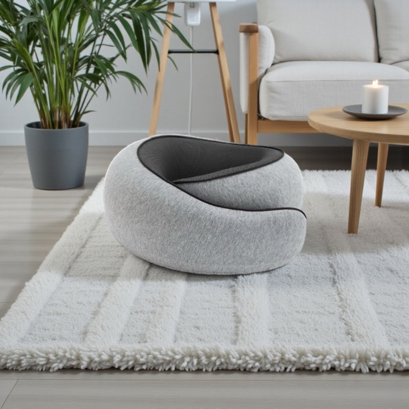 NuVibe™ ErgoNick Pillow in Pearl Grey in a modern living room, ergonomic neck cushion created for comfortable sitting and everyday relaxation.