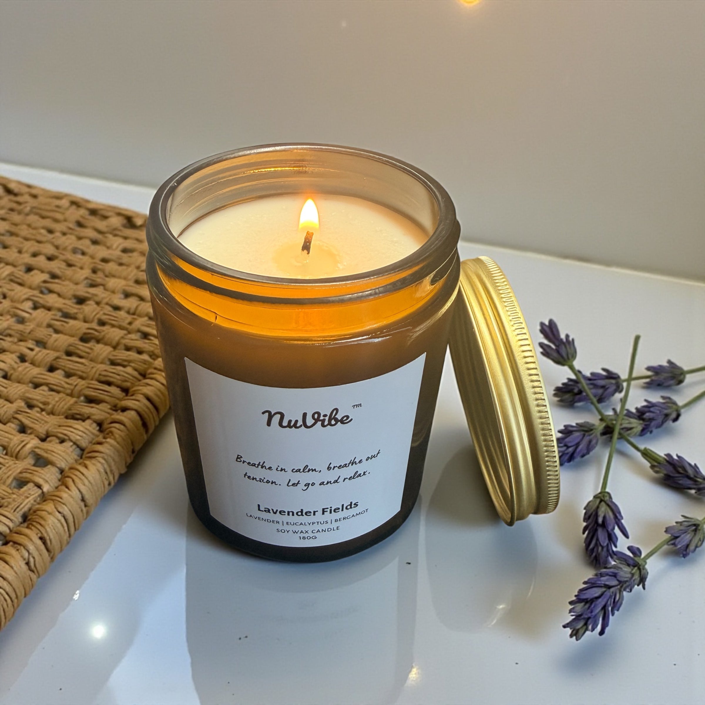 Natural soy wax candle with lavender, eucalyptus and bergamot essential oils shown from above in reusable amber jar
