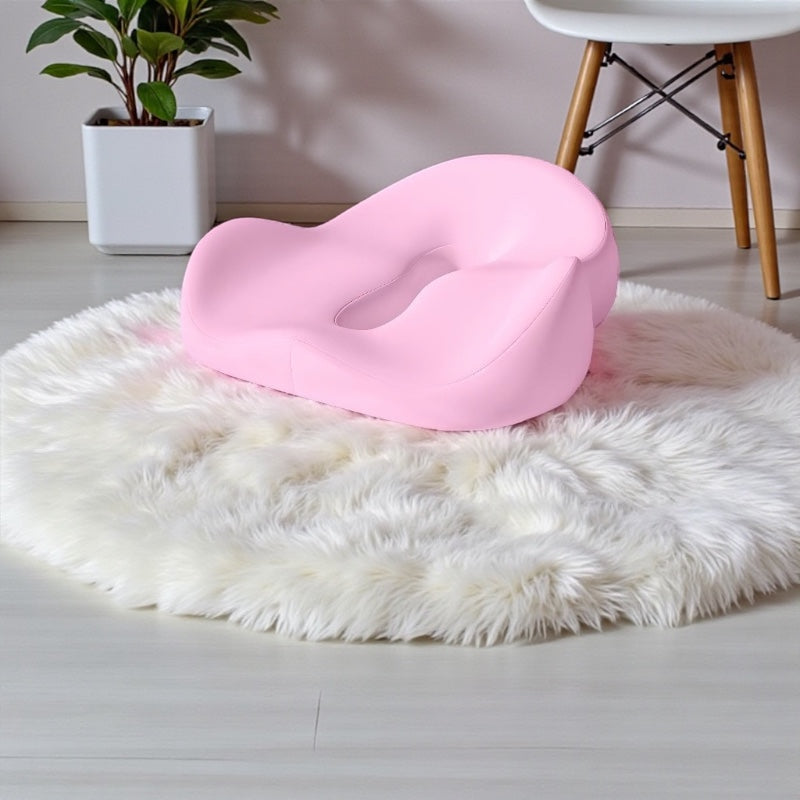 NuVibe™ Comfort Core Seat Cushion in Flamingo Pink shown in a modern home workspace, ergonomic wellness cushion for comfortable seating and posture support.