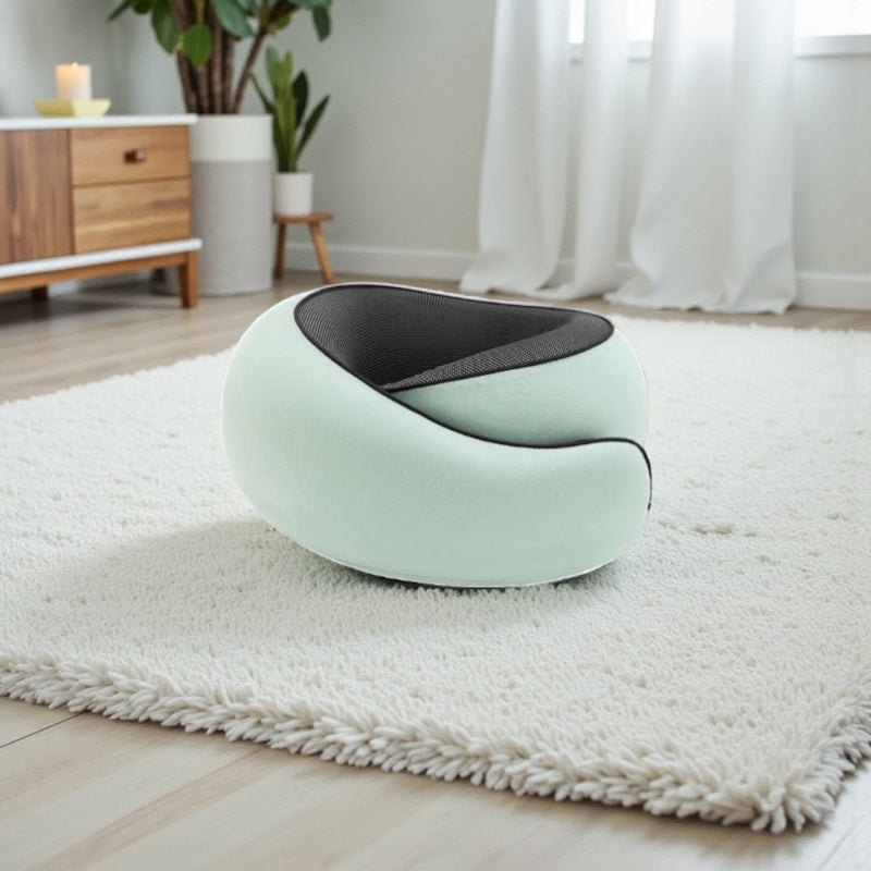 NuVibe™ ErgoNick Pillow in Cloud Mint on a soft rug in a bright home interior, ergonomic neck pillow created for all-day comfort and gentle support.