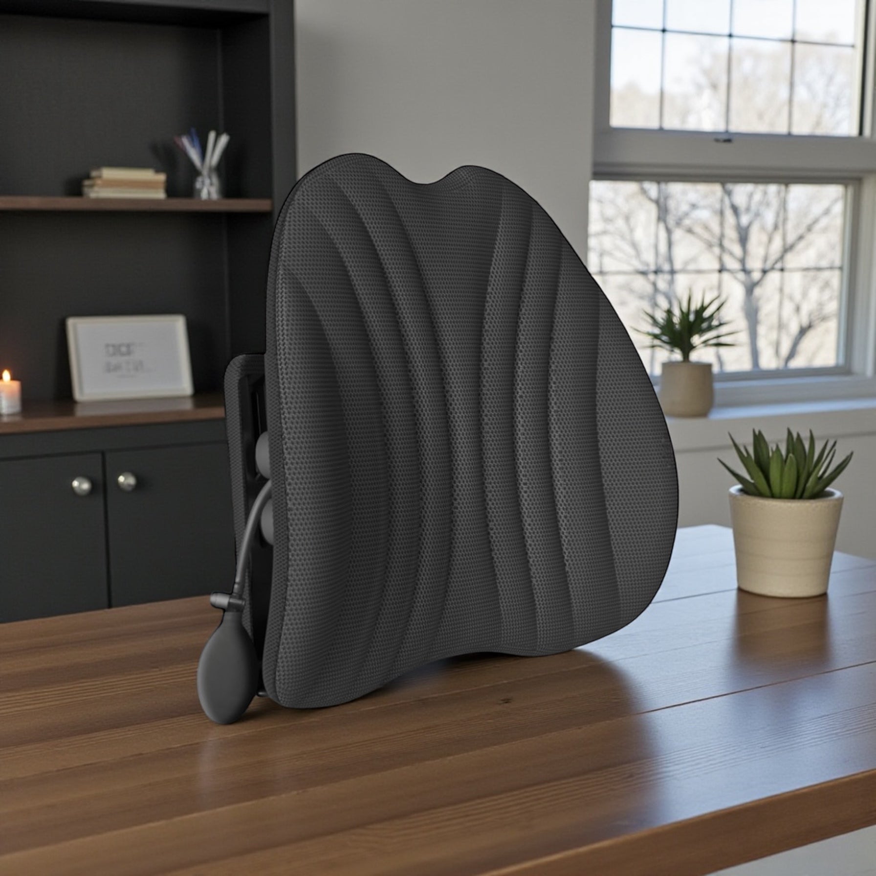 NuVibe™ Ergonomic Angel Cushion in Pure Black displayed in a modern home office, premium ergonomic back cushion designed for posture support and all-day sitting comfort.