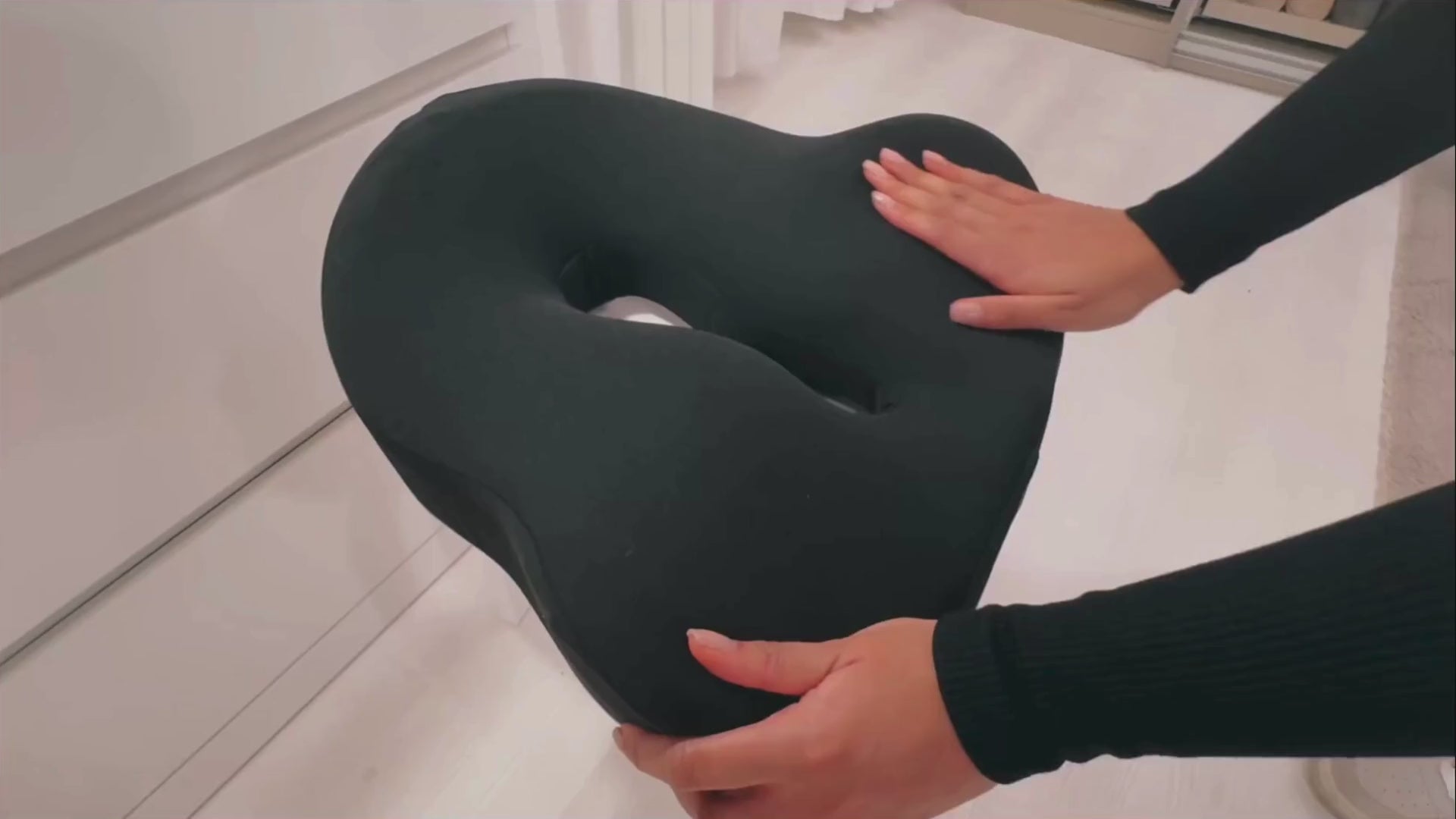 Video showcasing the NuVibe™ Seat Cushion in a cozy bedroom, demonstrating its ergonomic design and comfort for restful moments.