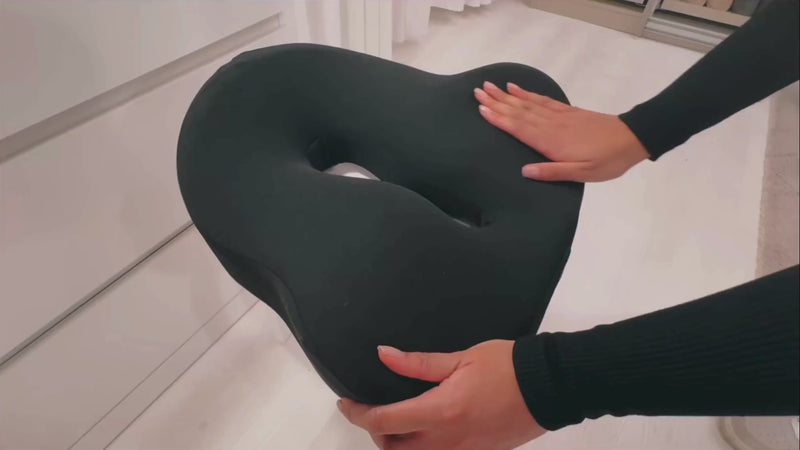 Video showcasing the NuVibe™ Seat Cushion in a cozy bedroom, demonstrating its ergonomic design and comfort for restful moments.